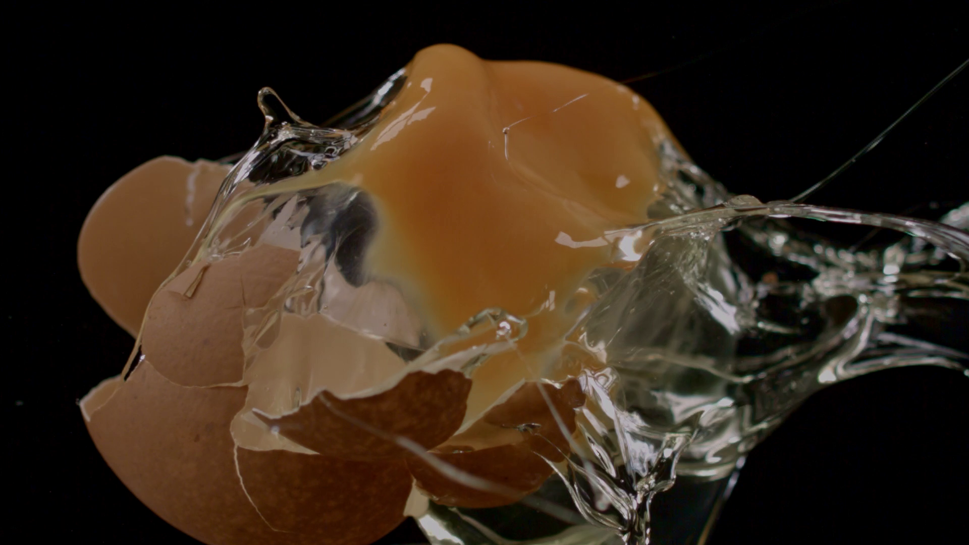 Egg breaking open - shot by high-speed camera